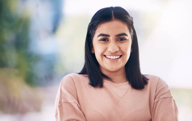 A smiling woman with long hair